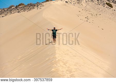Sotovento, Fuerteventura, Spain: 2020 October 8: Young Man Walks Through The Dunes At Playa De Sotav