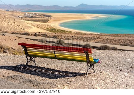 Colorful Bench To Contemplate View In Playa De Sotavento, Fuerteventura In Spain In Summer.