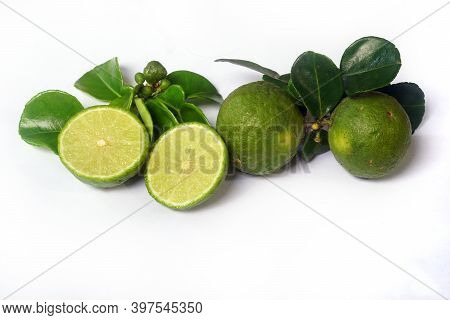 Kaffir Lime Or Citrus Hystrix. Some Are Whole, Some Have Been Sliced. Focus Selected, White Backgrou