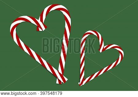 Pink Christmas Candy On Green Background. Xmas Festive Background. Love Symbol. Stock Image.
