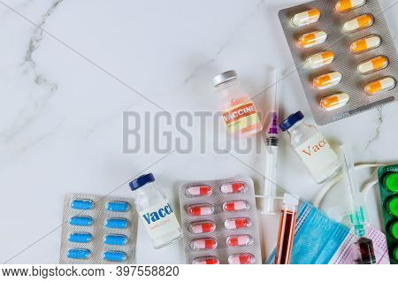 Assorted Pharmaceutical Medicine Pills, Tablets And Capsules On Coronavirus Vacine Bottle Sars-cov-2