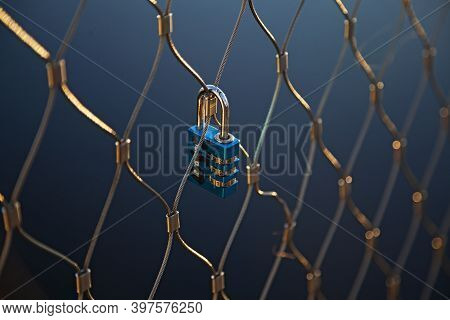 Umea, Norrland Sweden - November 23, 2020: A Blue Padlock That Symbolizes Love Mounted On A Bridge