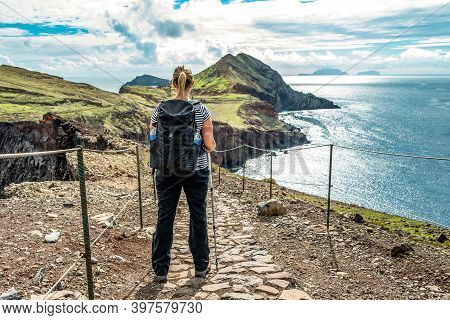 Girl Hiking Rocky Cliffs Clear Near Water Of Atlantic Ocean Bay Ponta De Sao Lourenco, The Island Of
