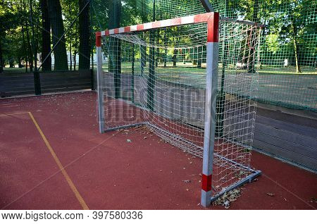 Public Multifunctional City Playground With Tartan Surface In The Park Is Used To Play Basketball Fo