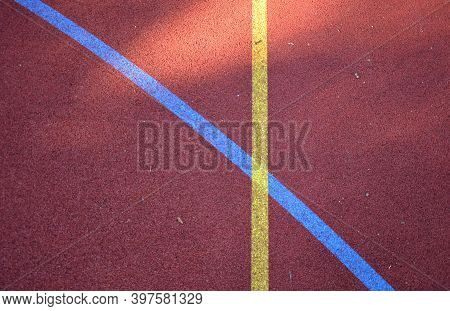 Public Multifunctional City Playground With Tartan Surface In The Park Is Used To Play Basketball Fo