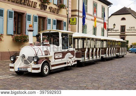 Eguisheim, France - September 10, 2010: A Tourist Train In Eguisheim Village In France. Eguisheim Is