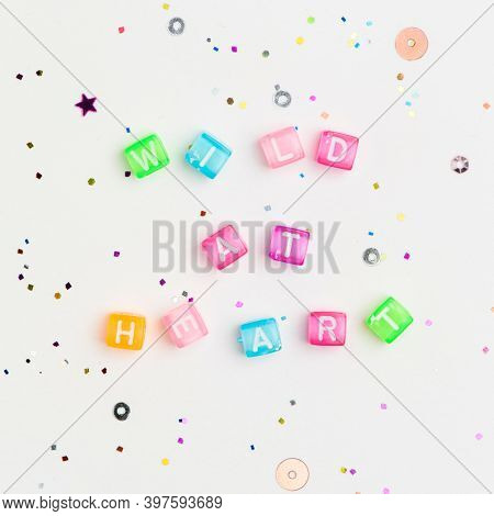 WILD AT HEART beads lettering word typography