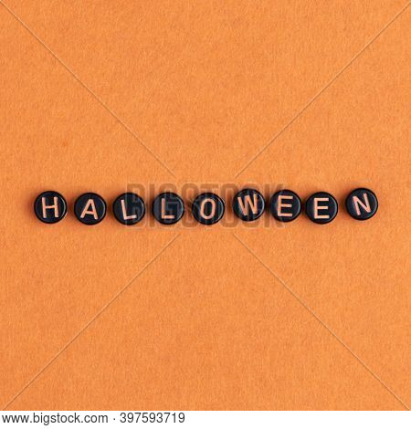 HALLOWEEN beads text typography on orange