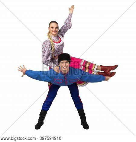 Beautiful Caucasian Cuple Dancing In Russian Folk Costumes Isolated On White Background. Full Length