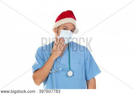African doctor wearing a Christmas hat at coronavirus time isolated on a white background