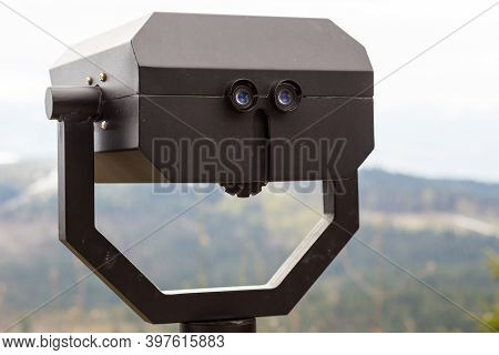 Touristic Telescope Look On Top Of Mountains, Close Up Metal Binoculars On Background Viewpoint Over