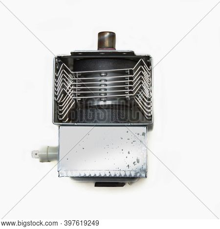 Magnetron From A Microwave Oven Isolated On A White Background