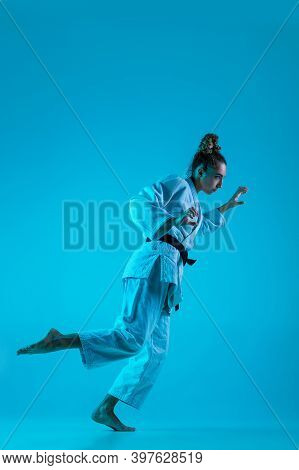 Active Training. Professional Female Judoist In White Judo Kimono Practicing And Training Isolated O