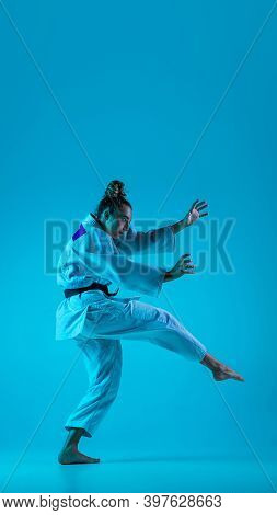 Active Training. Professional Female Judoist In White Judo Kimono Practicing And Training Isolated O