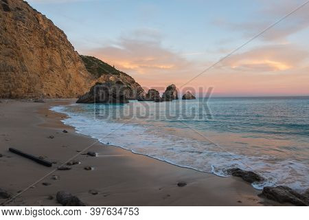 Ribeiro Do Cavalo Paradise Beach In Arrabida Natural Park In Sesimbra At Sunset, Portugal