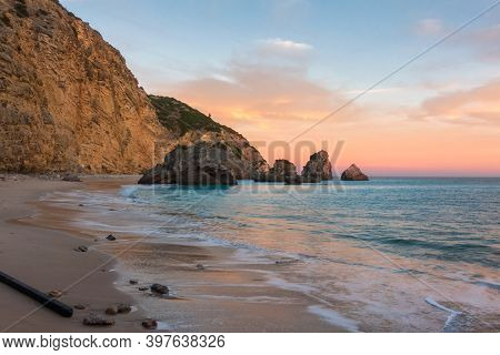 Ribeiro Do Cavalo Paradise Beach In Arrabida Natural Park In Sesimbra At Sunset, Portugal