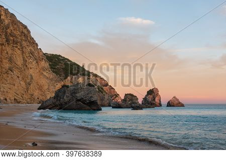 Ribeiro Do Cavalo Paradise Beach In Arrabida Natural Park In Sesimbra At Sunset, Portugal