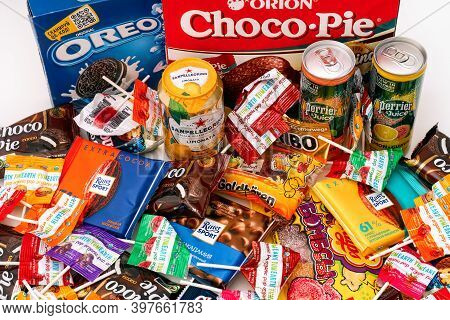 Tambov, Russian Federation - October 30, 2020 Heap Of Sweet Snacks And Drink Jars On The Table. Oreo