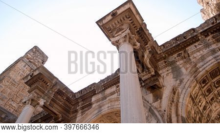 Columns And Ruins Of Antique Architecture. Hadrians Gate In Old Town Kaleici District In Resort City