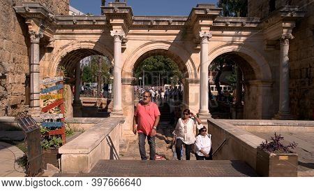 20.10.2019 - Antalya, Turkey. Hadrians Gate In Antalya, Turkey. People At Hadrians Gate. Ancient Arc