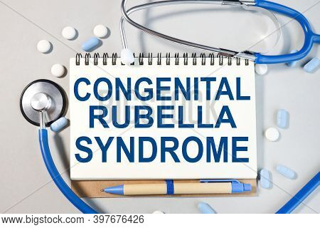 Conggenital Rubella Syndrome, Text On White Paper On Gray Background. Medical Concept