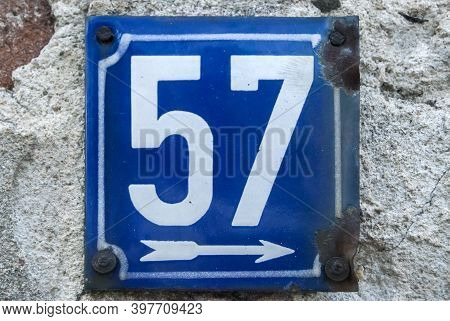 Weathered Grunge Square Metal Enameled Plate Of Number Of Street Address With Number 57