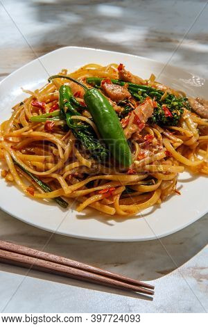 Pad Kee Mao Otherwise Known As Drunken Noodles Is A Spicy Thai Stir-fried Noodle Dish With Thinly Sl