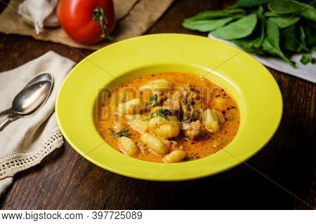 Italian Cuisine Sausage Gnocchi Soup With Tomato Basil Broth