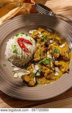 Indian Chicken Korma Curry Dinner With Basmati Rice And Almonds