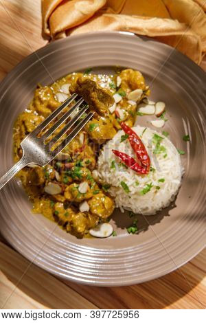 Indian Chicken Korma Curry Dinner With Basmati Rice And Almonds