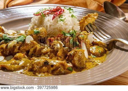 Indian Chicken Korma Curry Dinner With Basmati Rice And Almonds