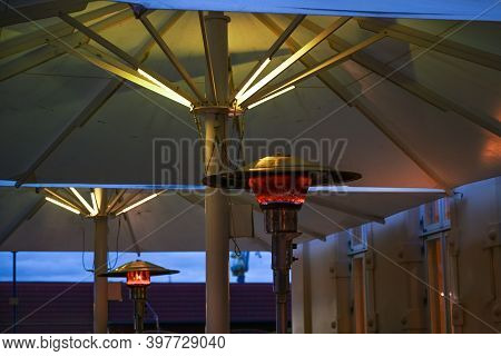 Gas Burning Patio Heater On A Restaurant Terrace With Bad Environmental Effects, Allows Dining Outsi