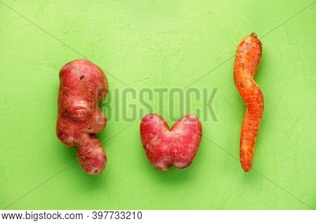 Ugly Funny Vegetables, Lumpy Potatoes In The Shape Of A Heart And Letters And A Twisted Carrot On A 