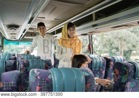 Muslim Couple Travel By Bus During Eid Mubarak Holiday