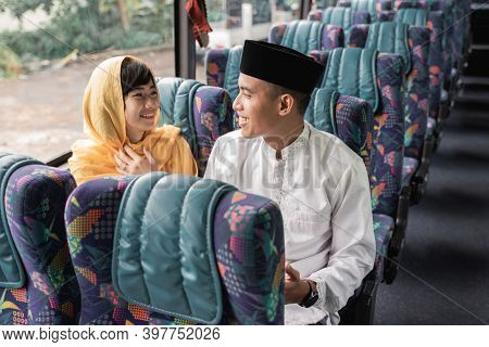 Muslim Couple Travel By Bus During Eid Mubarak Holiday