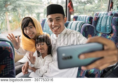 Muslim Holiday Trip Riding A Bus Together With Family