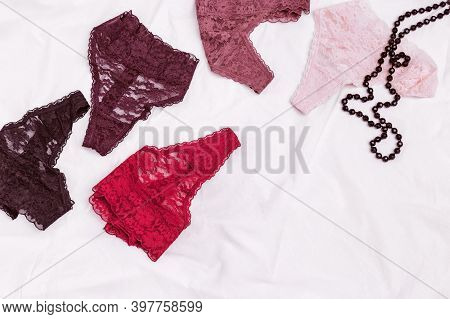 Different Panties Fow Women. Fashion Trendy Lace Lingerie. Colorful Underwear And Black Round Beads.