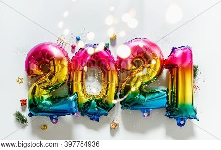 Rainbow colored Foil balloons in the form of numbers 2021. New year celebration