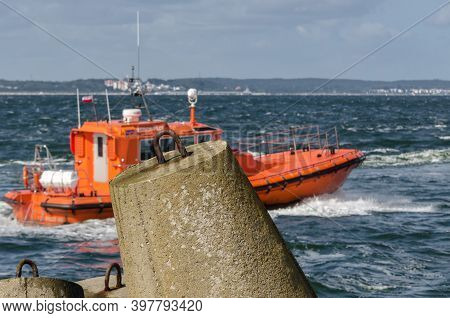 Swinoujscie, West Pomeranian - Poland - 2020: Dolos With A Floating Boat Of Sea Pilots In Roadstead 