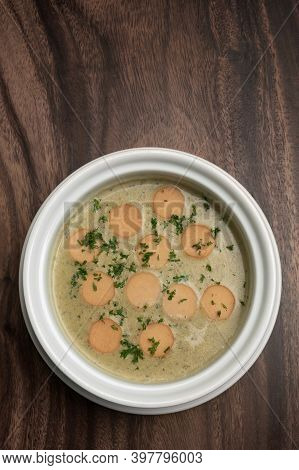 German Traditional Kartoffelsuppe Potato And Sausage Soup On Wood Table Background