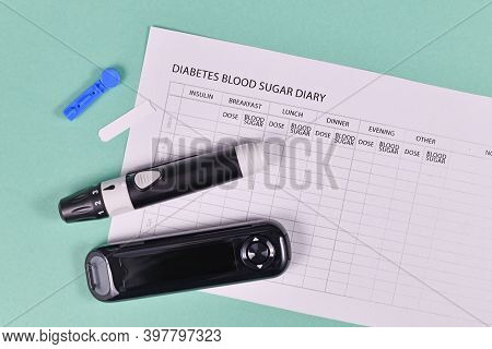 Diabetes Blood Sugar Diary With Blood Glucose Meter, Lancets, Tests Stripes And Lancing Device On Gr