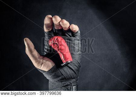 Red Boxing Glove In A Mans Hand