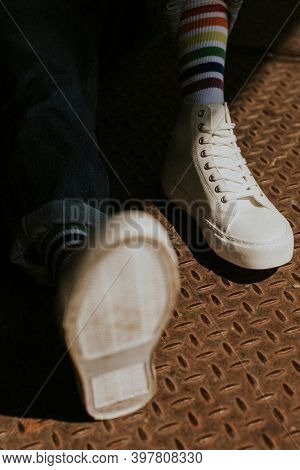 Model in white canvas sneakers high top
