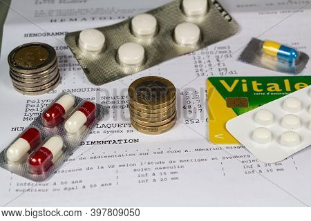 Primelin - France, December 11, 2018 : Results Of Blood Test Written In French Language, Euros Coins