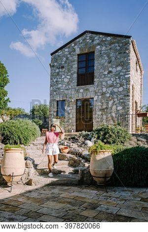 Woman On Vacation At Agriturismo Bed And Breakfast At Sicily Italy, Beautiful Historical Old Farm Re