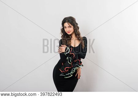 Portrait Of Beautiful Young Woman Dancing Flamenco In Studio