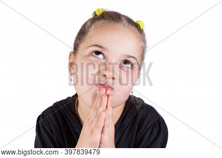 Little Girl Praying Dreaming. Child Makes A Wish.