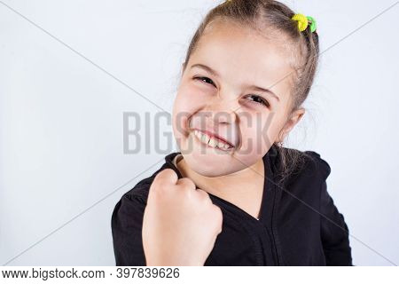 Girl With Grin. Threatens With Fist.