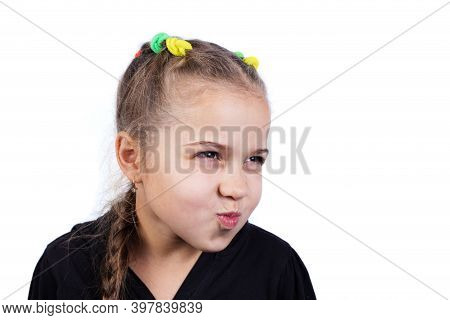Mad Little Girl. Angry Kid On A White.