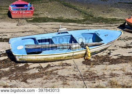 Portosin, Spain. September 11, 2020. Old Galician Wooden Rowboat In A Harbor. Coruña Province, Rias 